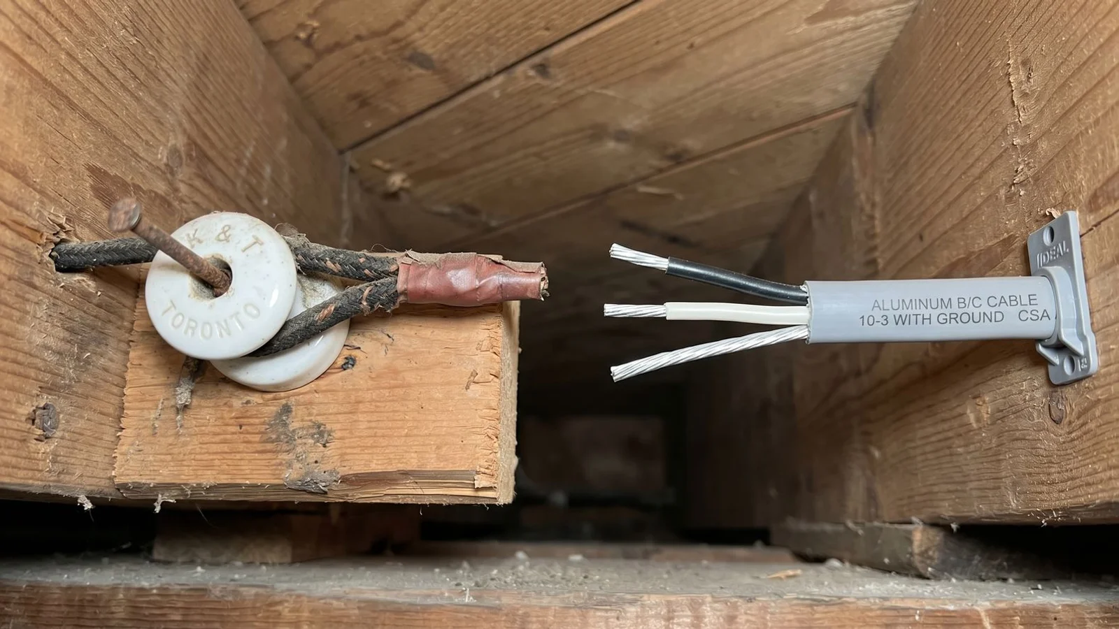 Side-by-side photo: porcelain K&T knob vs aluminum branch-circuit cable in Toronto basement